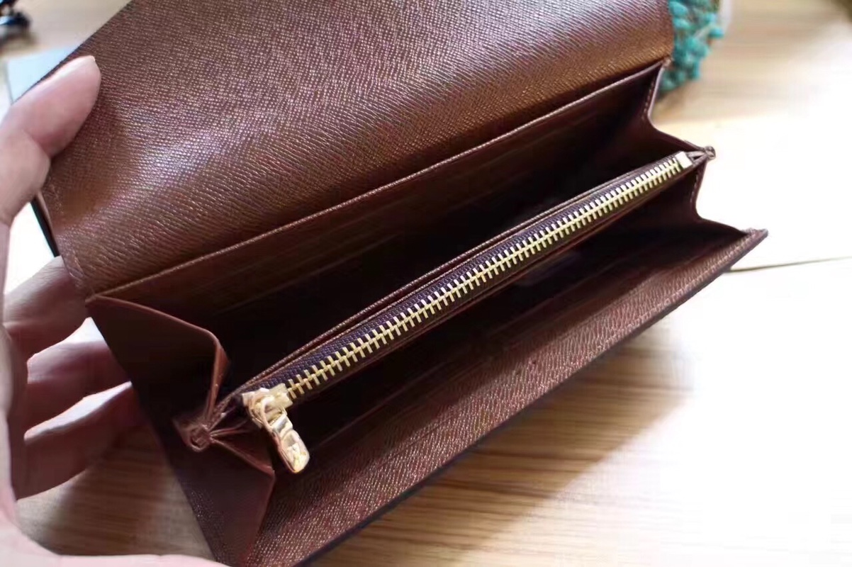 エレガントなモノグラム帆布の信封式財布