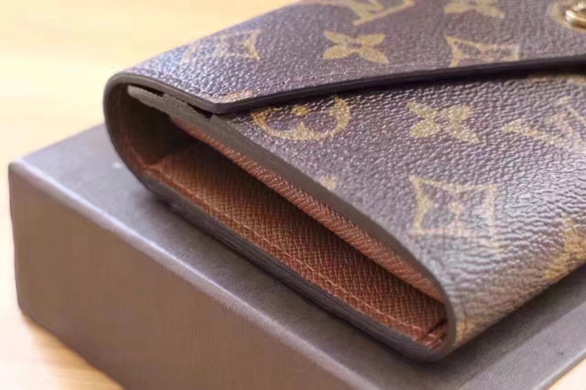 エレガントなモノグラム帆布の信封式財布