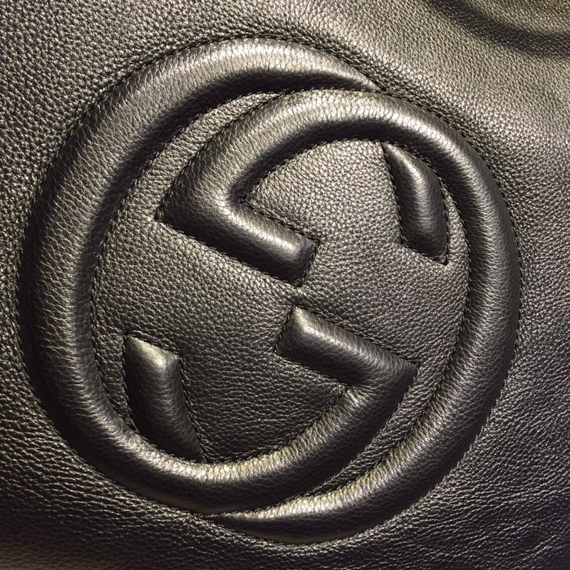 GUCCI古驰女士牛皮时尚双G浮雕纯色手提包282309