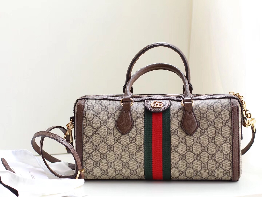Gucci Ophidia Boston Medium Top Handle Bag features GG Supreme canvas with signature red and green web stripe. The compact double G logo is inspired by Gucci’s 1970s archive design. Equipped with a detachable strap for versatile wear. Every detail is a premium replica, indistinguishable from the original. Dimensions: 32x16x12 cm. Style code: 524532.556068. image 1