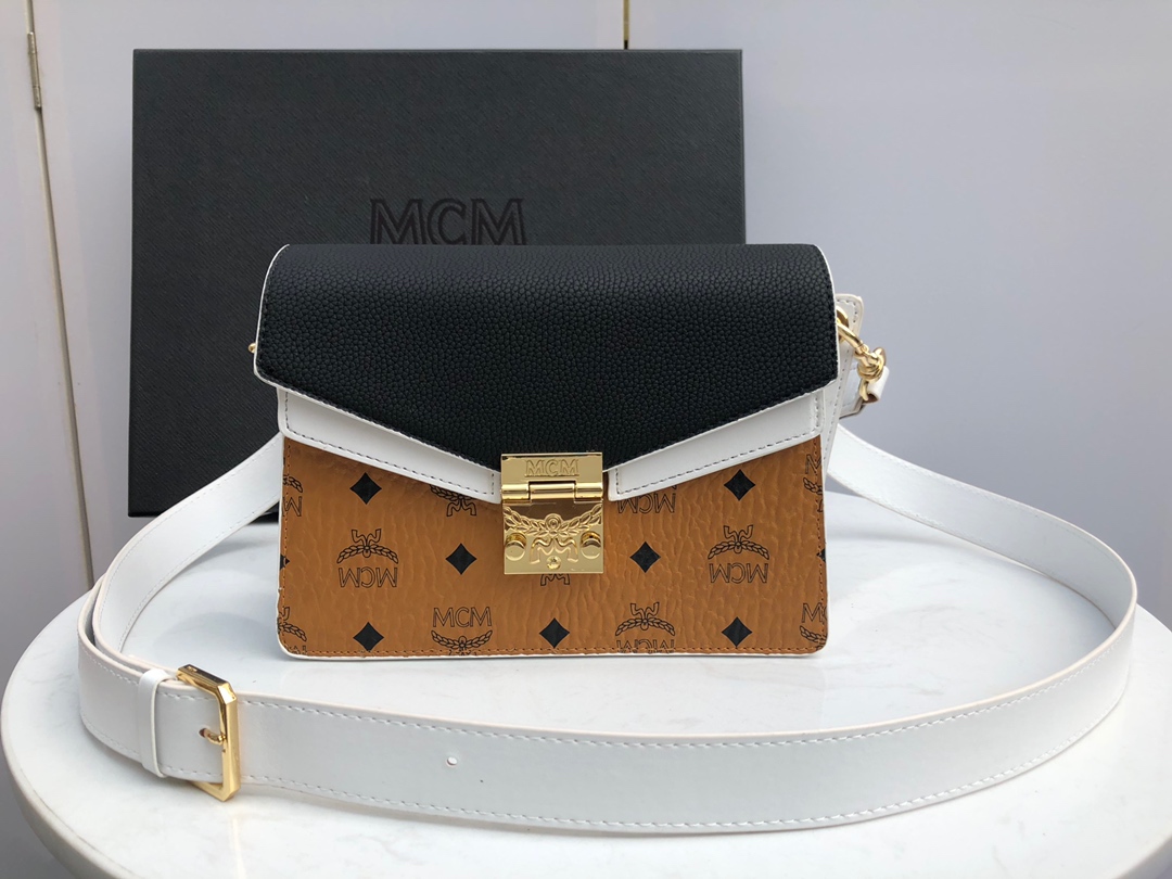 Top quality item 💐【New Arrival】Comes with gift box 🎁 This shoulder bag is designed with a mix of geometric shapes, combining style and structure. Introducing our new Mezzanin bag, crafted with our famous MCM classic Visetos and color-block leather, featuring a detachable shoulder strap for a refined look. It reinterprets the classic bag for day-to-night versatility in a modern style. Size: 20 x 26 x 10 cm. image 1