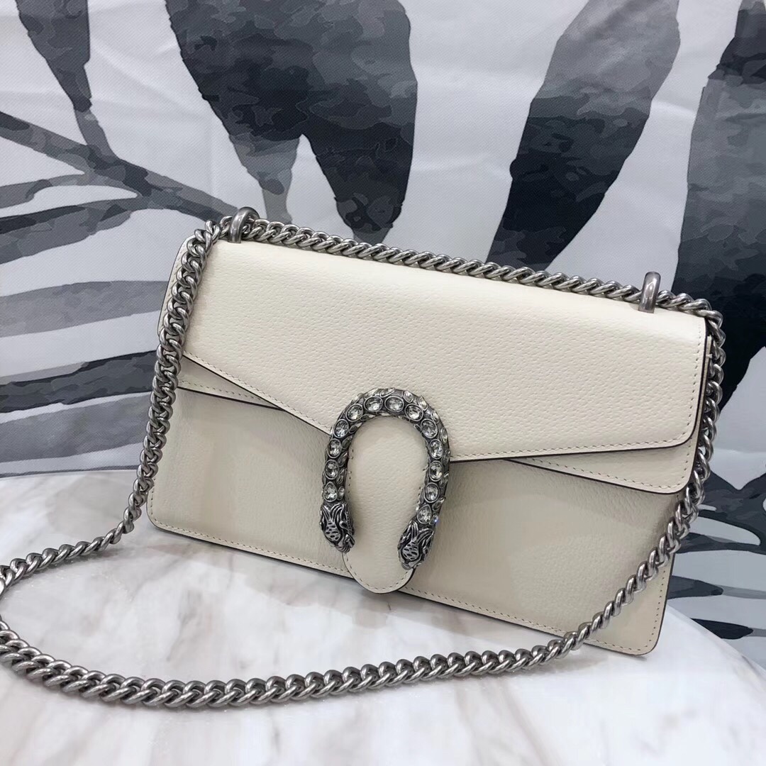 # New Dionysus White # Model 400249, Size 28*17*10 cm.  
Top-quality original, made from imported genuine leather with an excellent texture and a cool, stylish design. Elegant and practical, featuring crystal-embedded Dionysus hardware paired with lychee-grain leather for a noble look. The double tiger head clasp is adorned with Swarovski crystals, making it truly irresistible. Can be worn crossbody or on the shoulder—however you wear it, it looks stunning. image 1