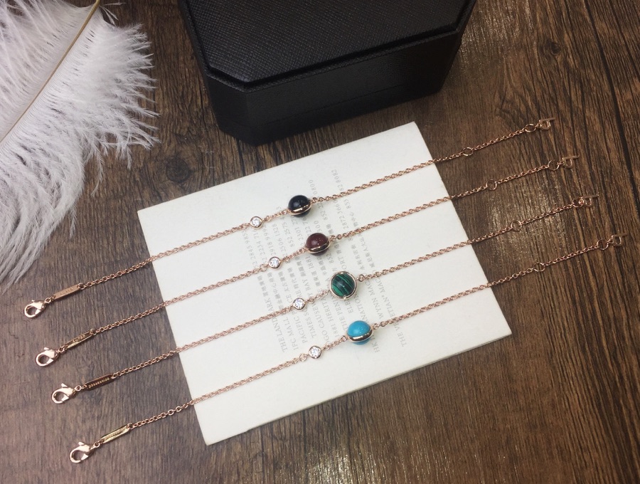 “Count’s Latest Possession Bracelet: Rose Gold with Gemstones and Diamond Accents”