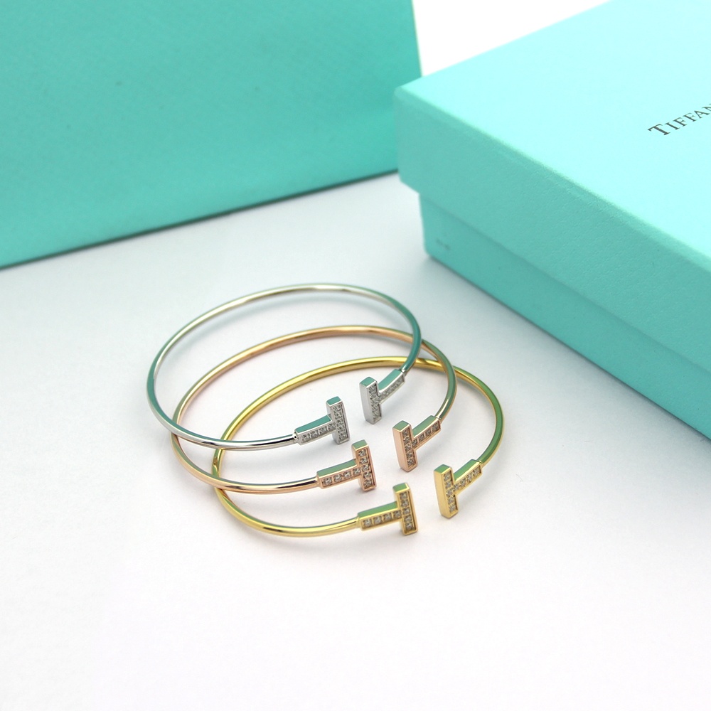 Tiffany Tiffany T bracelet Available in 18k rose gold 18k yellow gold and sterling silver all set with clear round brilliant diamonds 17cm inner circumference