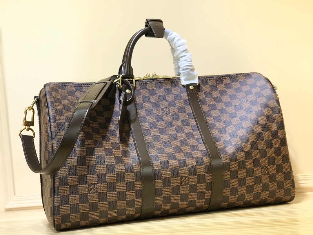 NO:581656,Top original single M41416 n41428 Kage The Keeall series, launched in 19, is the modern ancestor of handbags. It has a soft texture, a spacious interior, is made of Damier canvas, and is equipped with double zipper closure. Size 45x27x20 (cm) 64017075,19860909顶级原单M41416 n41428咖格 于19面市的Keeall系列,是手提包的现代始祖.它质地柔软,内部宽敞,以Damier帆布制成,配有双拉链开合. 尺寸45x27x20（cm）64017075,,Bag