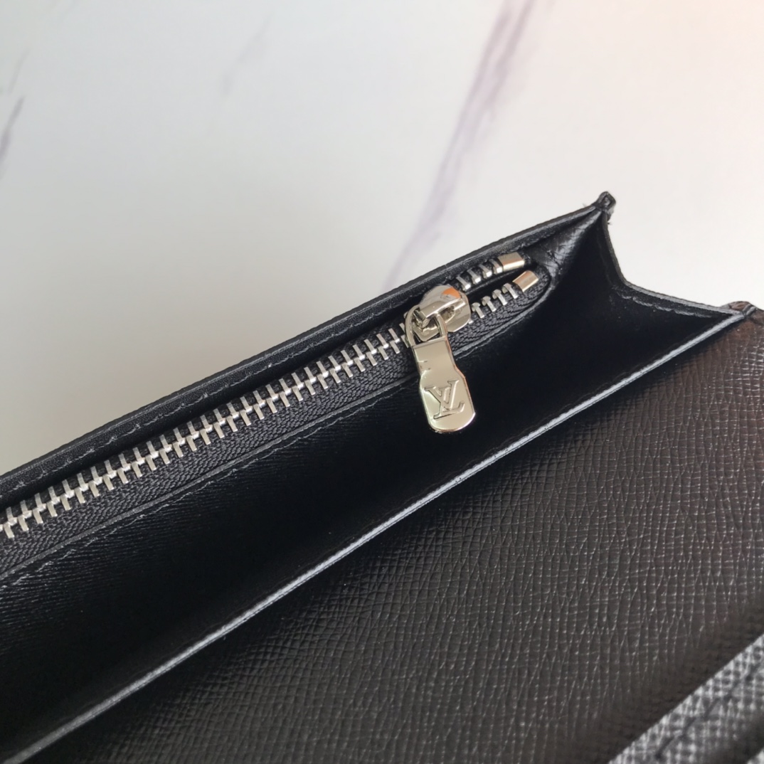 Leather Bifold Wallet being carried in hand