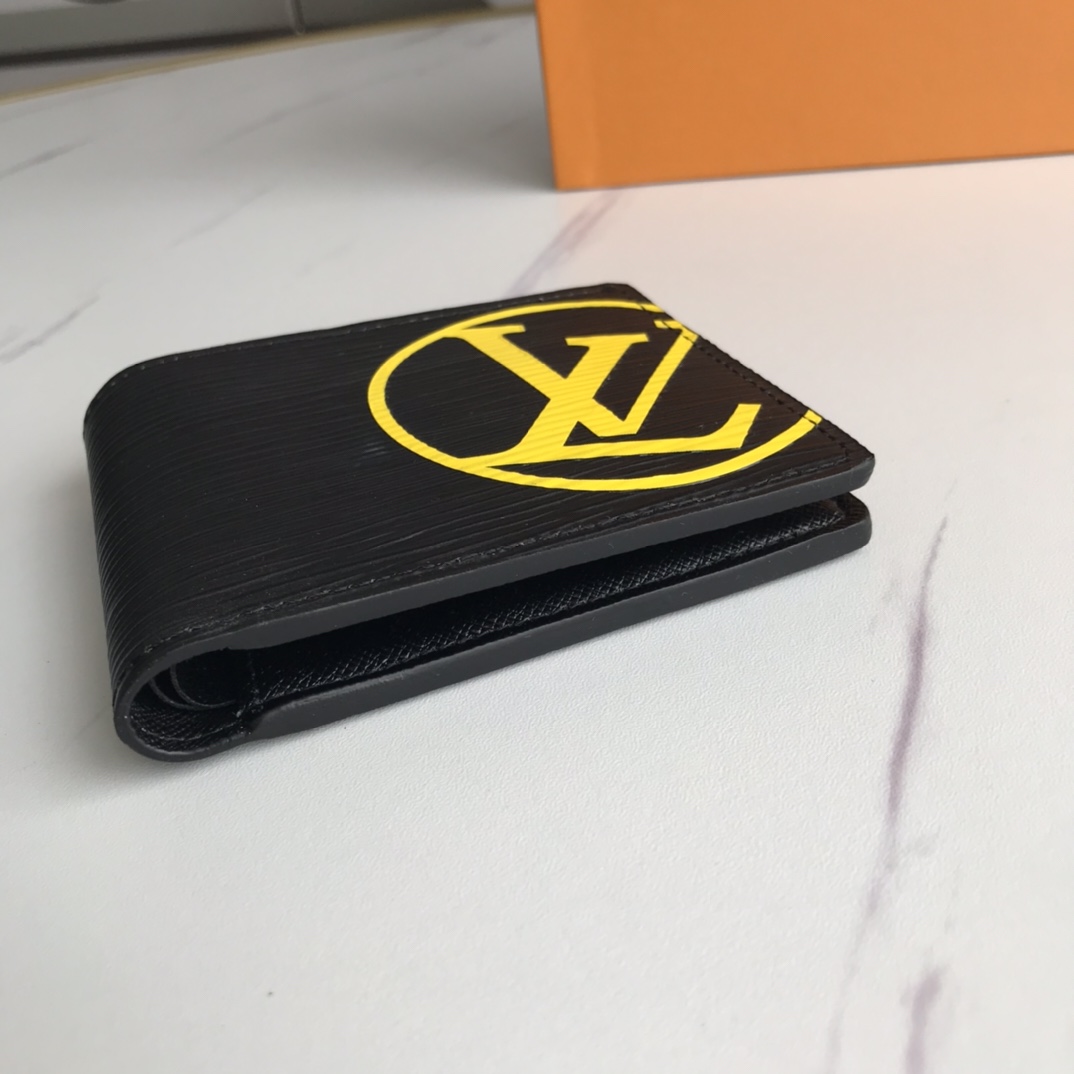 Man holding a leather bifold wallet