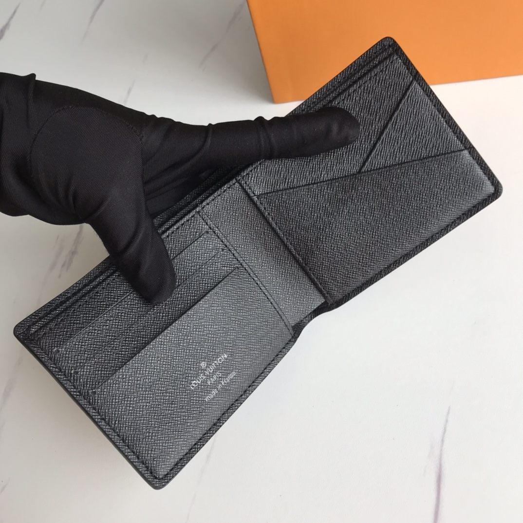 Interior of a leather bifold wallet with cards and cash