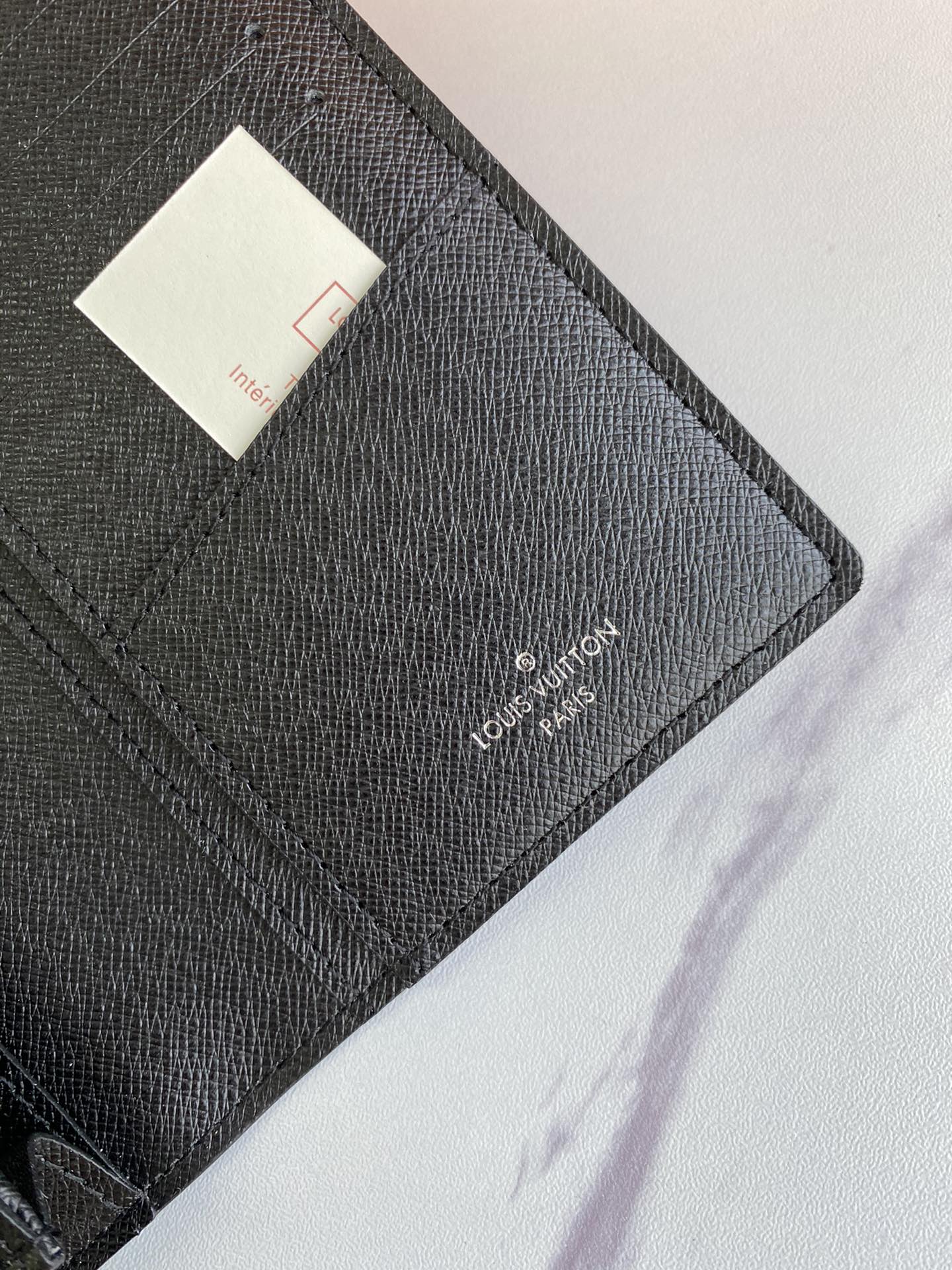 Close-up detail of leather wallet stitching