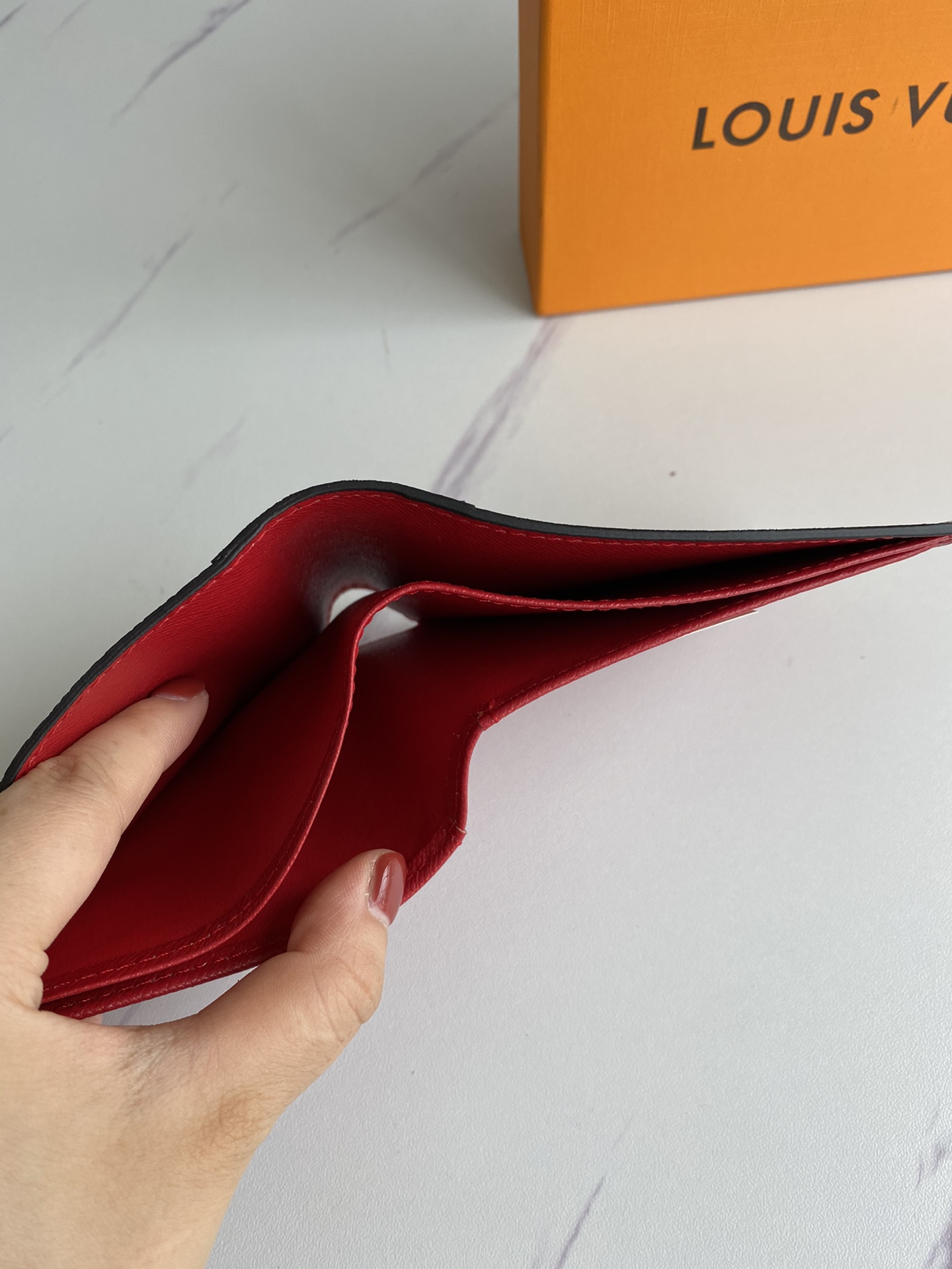 Leather bifold wallet in gift packaging