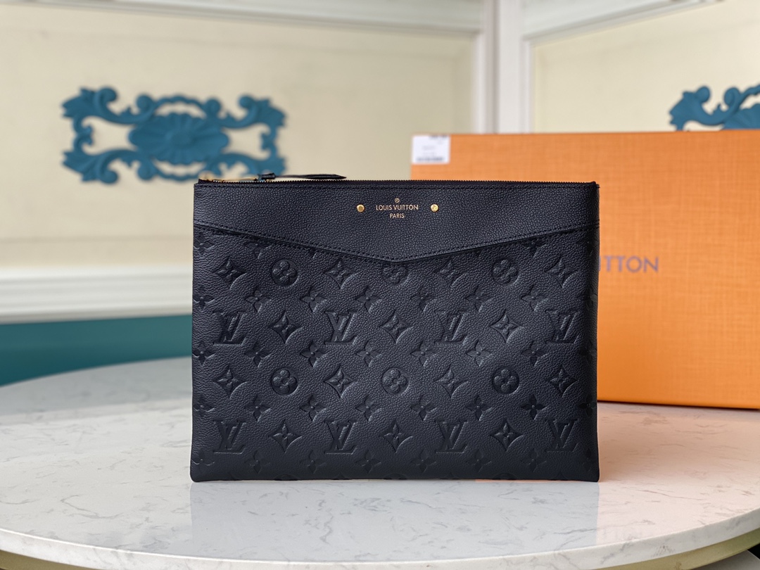 embossed with the iconic Louis Vuitton Monogram pattern, this Daily - Bag