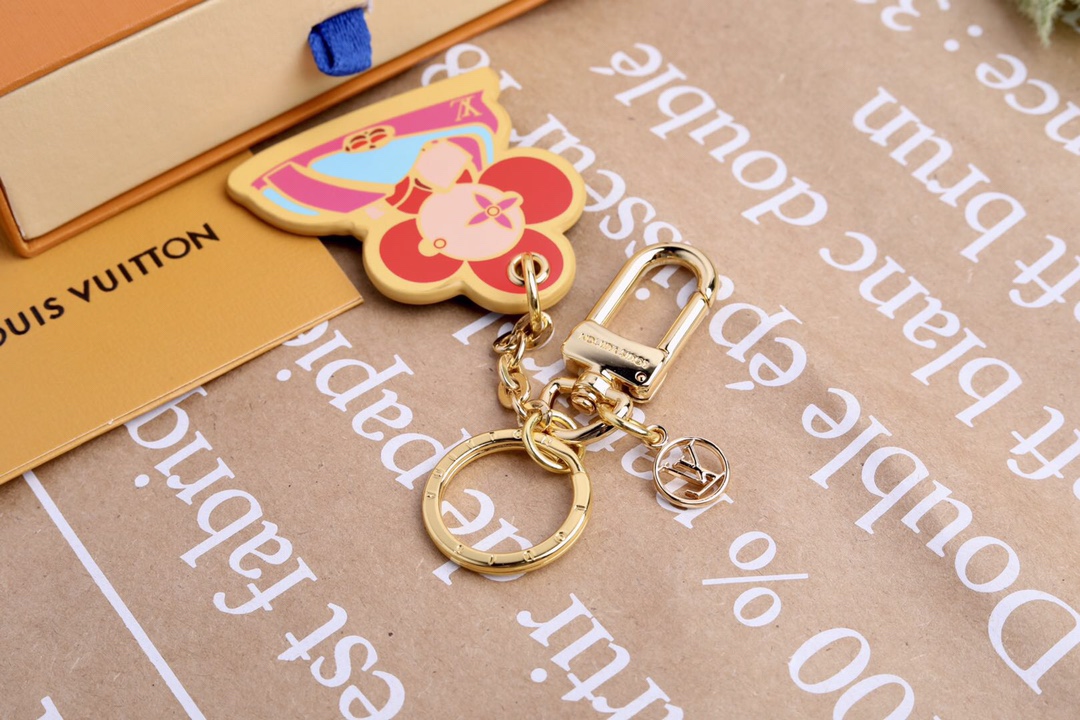 “Vivienne Funfair Xmas Bag: Colorful Metal Fittings and Dynamic Mascot Design” - 图片 2
