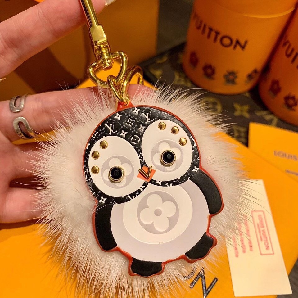 Penguin keychain attached to a handbag