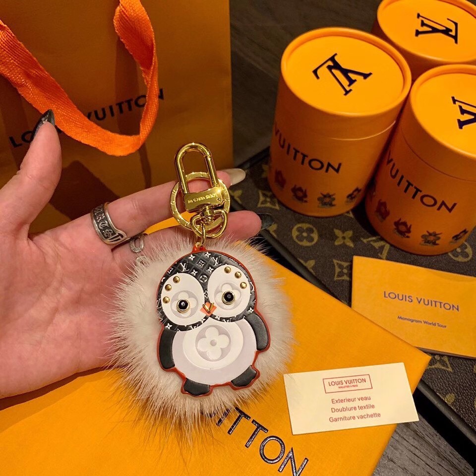 Front view of a penguin charm keychain