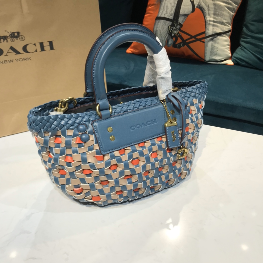 Coach贝壳包是真皮吗