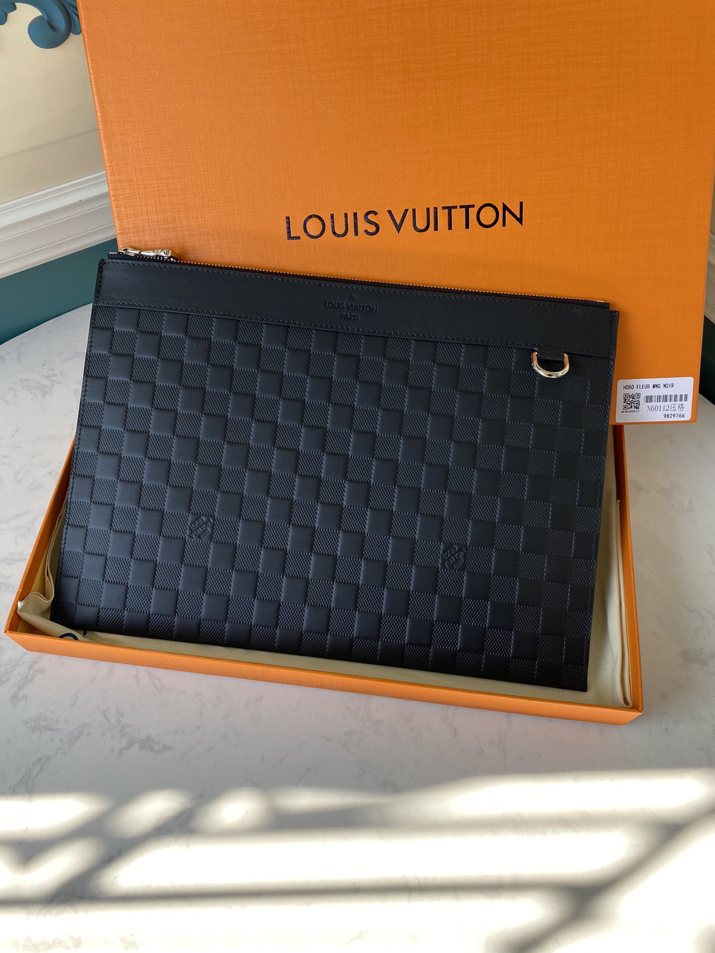the Pochette Apollo is an elegant choice for carrying documents and - Bag