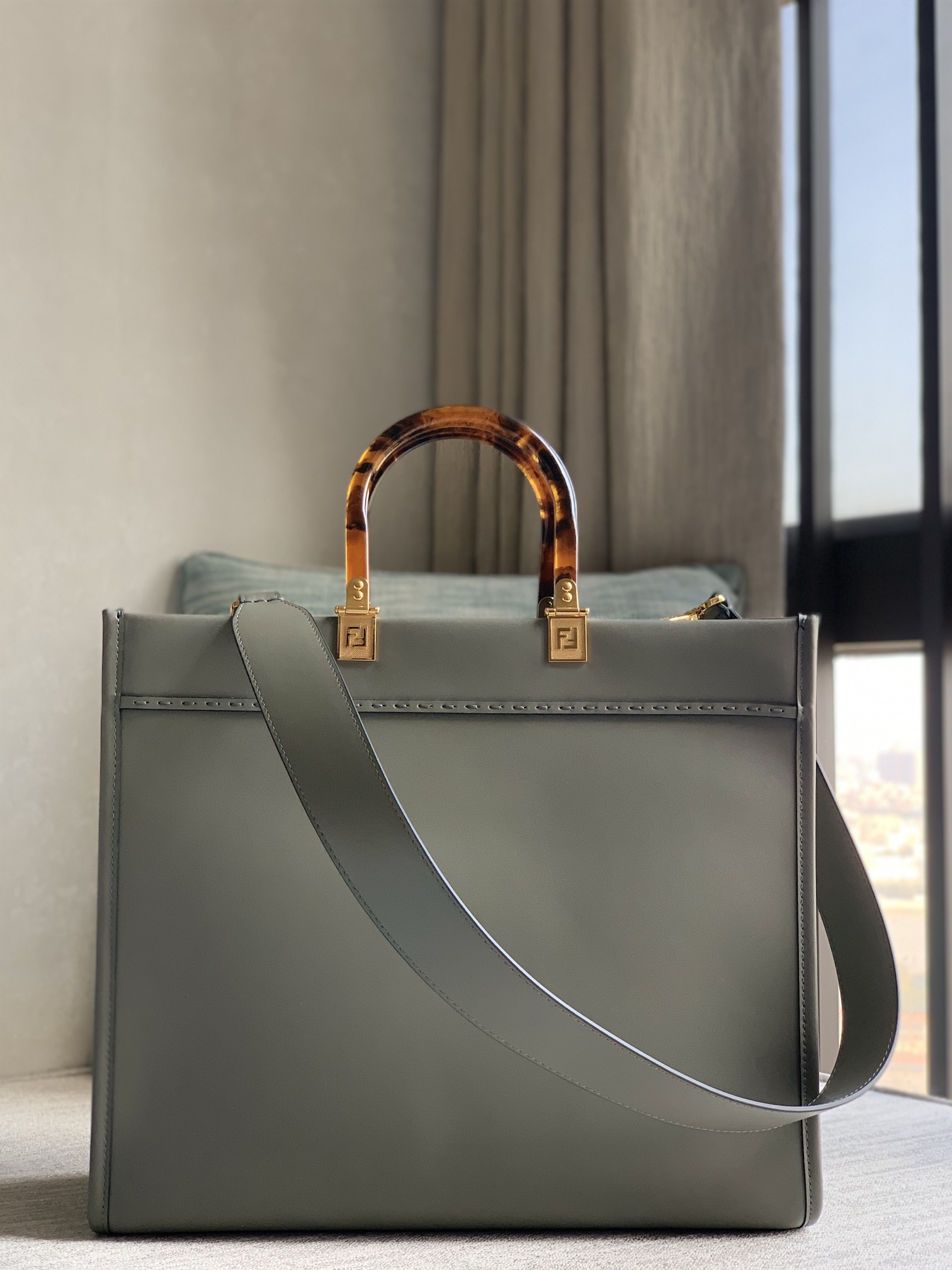 Fendi Sunshine tote bag, medium gray full calfskin, decorated with hot-stamped "FENDI ROMA" pattern. Featuring spacious Alcantara-lined interior