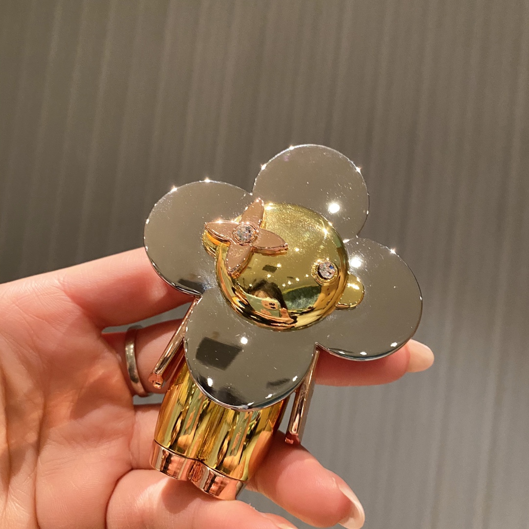 Vivienne doll keychain hanging on a handbag