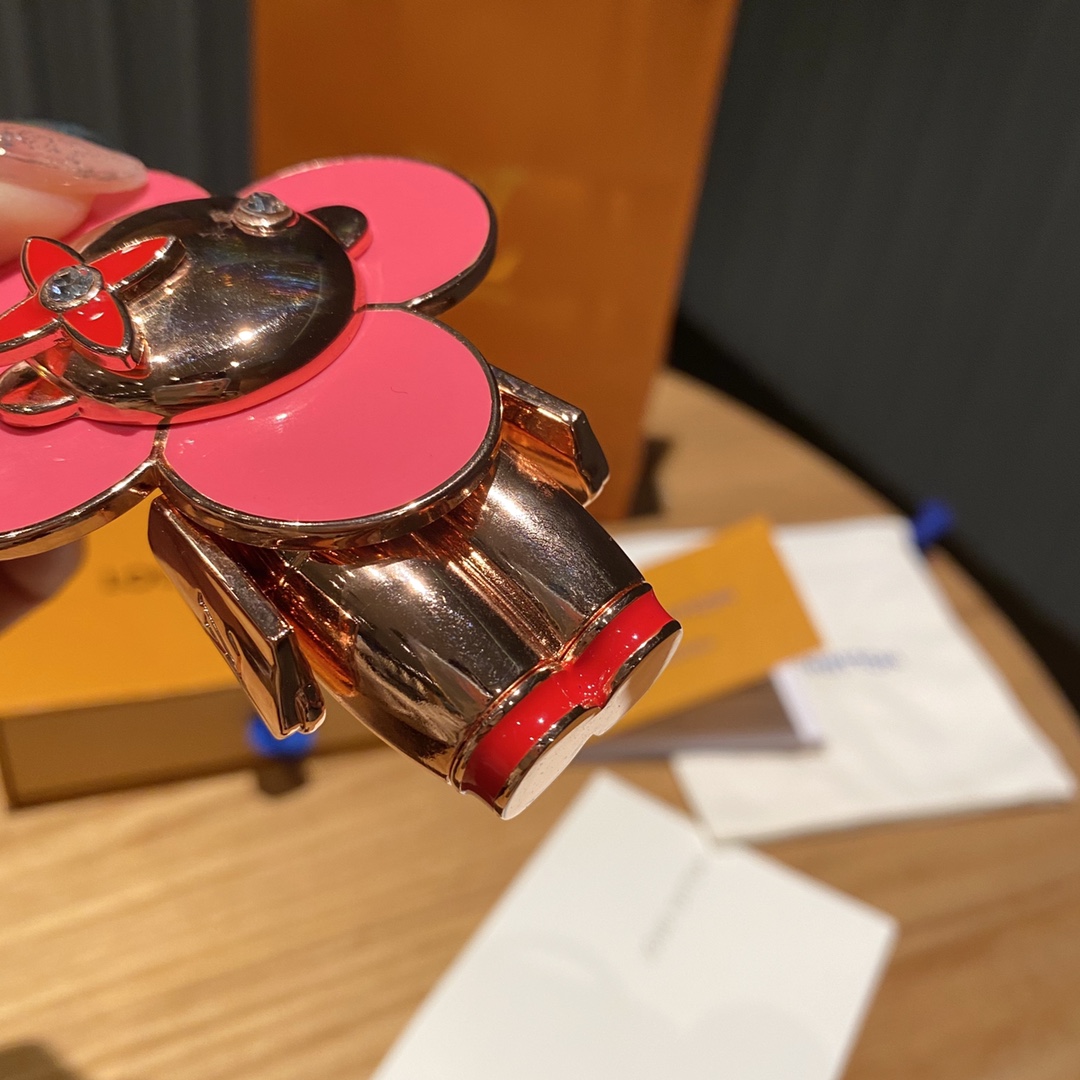 Vivienne doll keychain hanging on a handbag