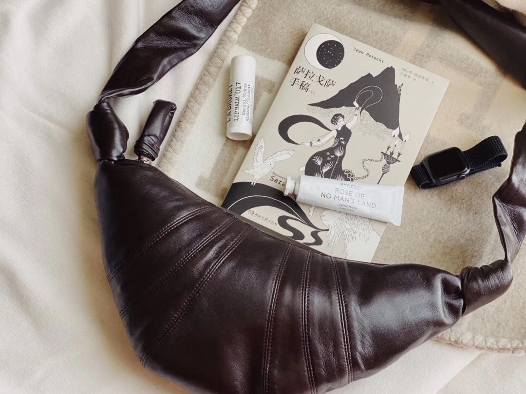 Crafted from rich, tactile lambskin with a distinctive, contemporary sil - Comprehensive
