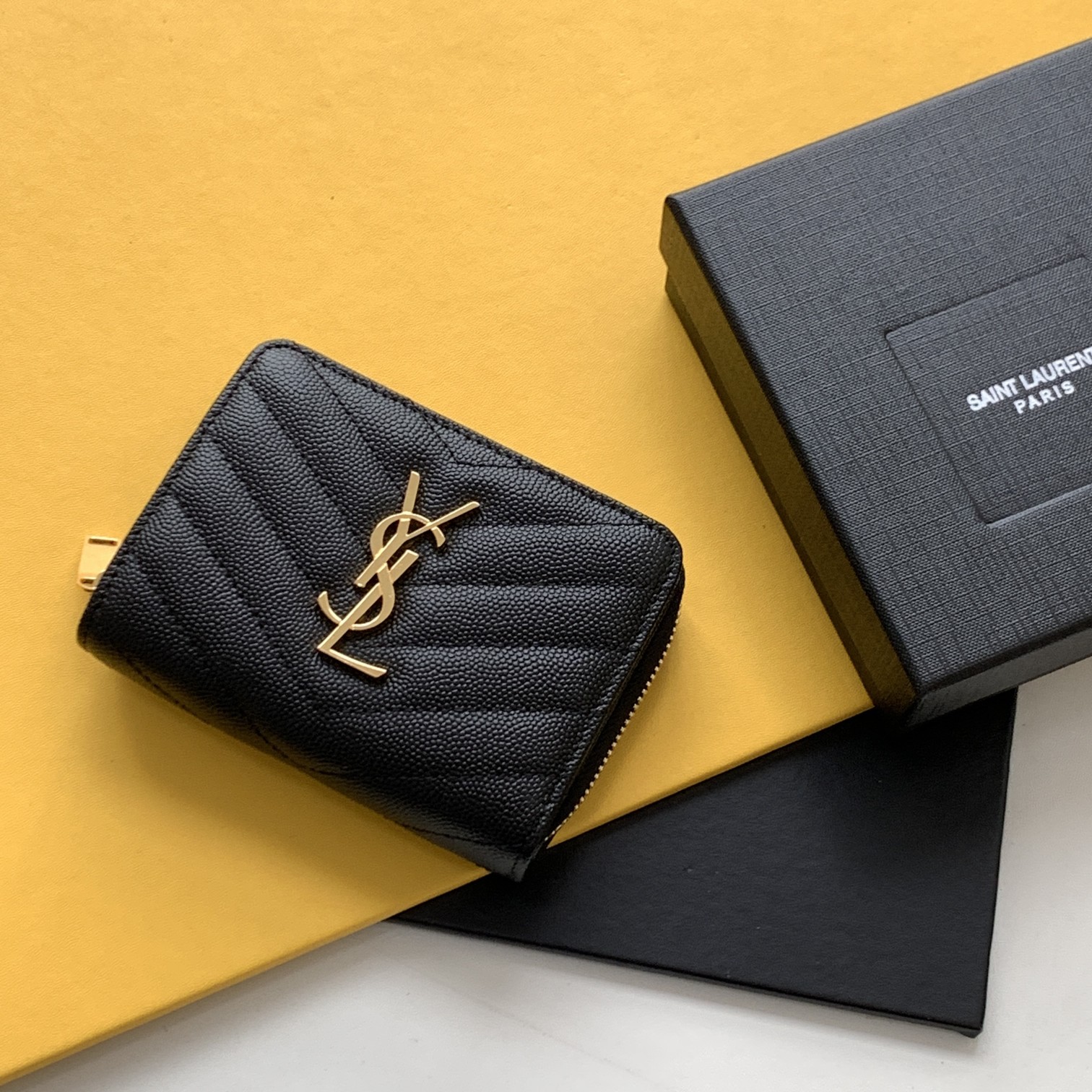 Black grained textured leather short round zip wallet with gold YSL logo