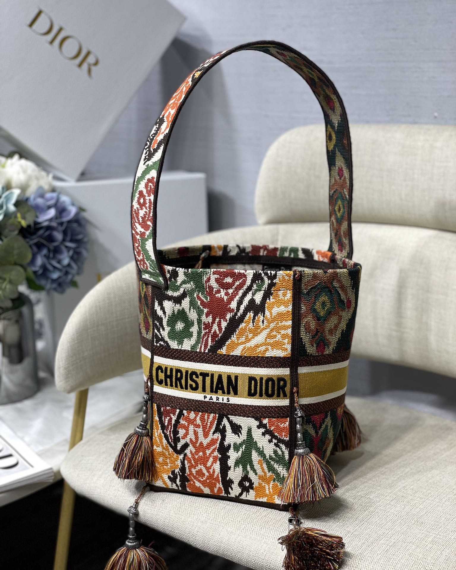D-Bubble Embroidered Bucket Bag Wide Shoulder Strap Pom-pom Decoration
