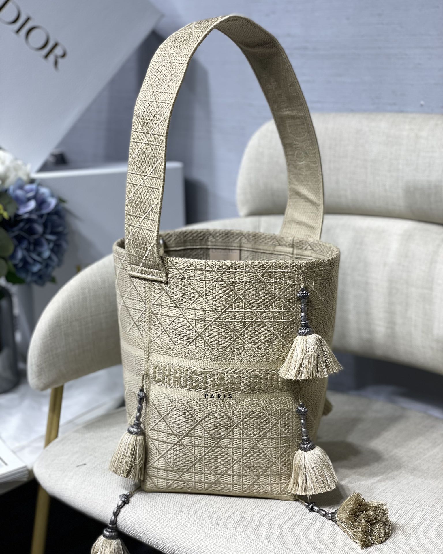 D-Bubble Bucket Bag Cannage Embroidery Straw Effect Pom-Pom Wide Shoulder Strap