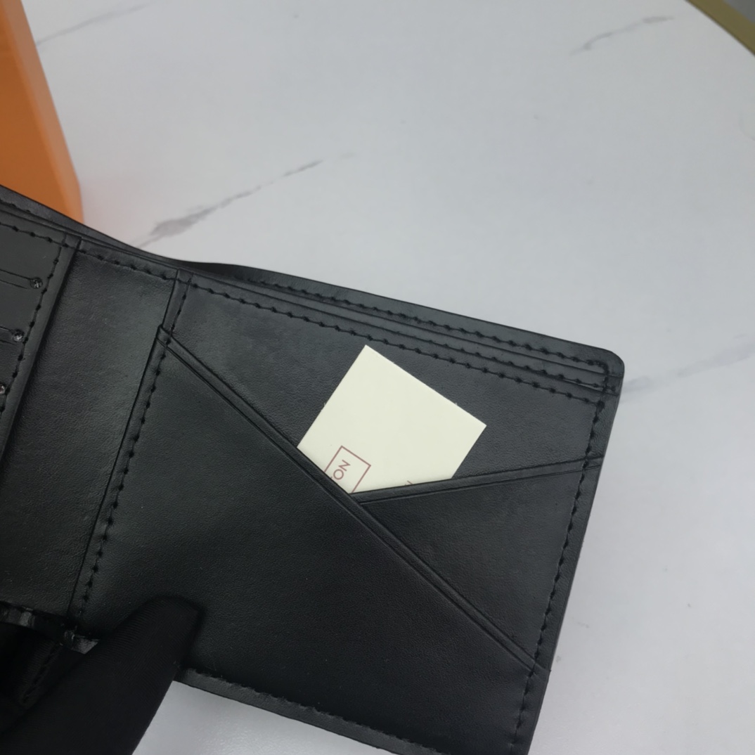 Close-up of stitching on the bifold leather wallet