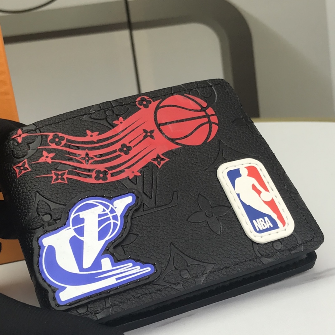 Bifold leather wallet held in hand