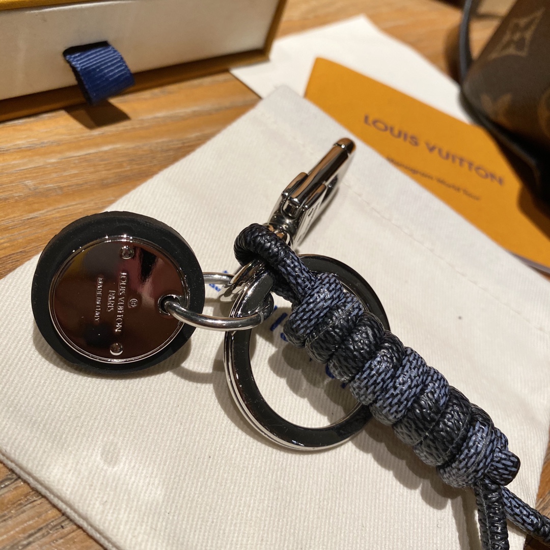 Close-up of the logo on the luxury leather rope keychain