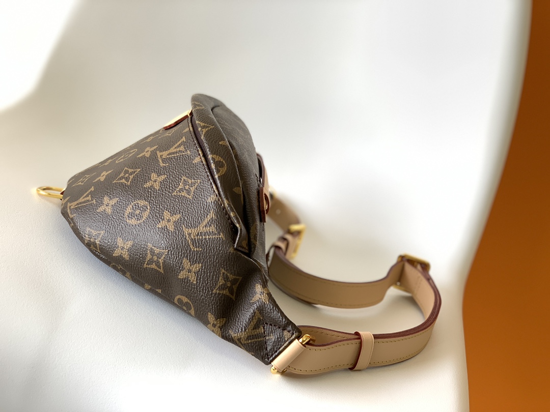 Crafted from classic Monogram canvas and accented with a "Louis Vuitton - Bag 2