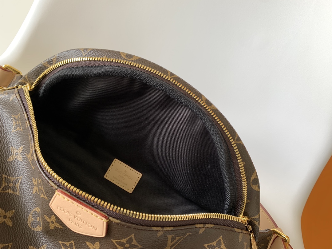 Crafted from classic Monogram canvas and accented with a "Louis Vuitton - Bag 8