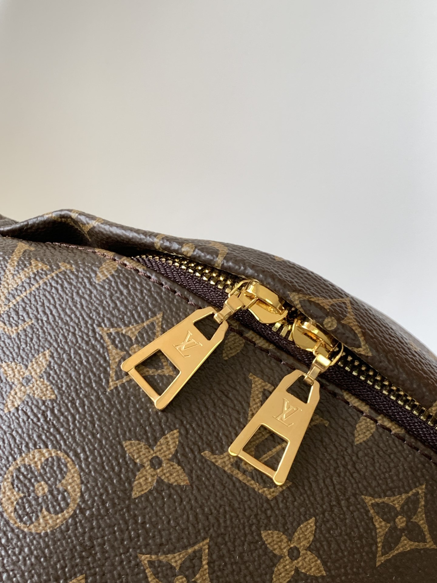 Crafted from classic Monogram canvas and accented with a "Louis Vuitton - Bag 5