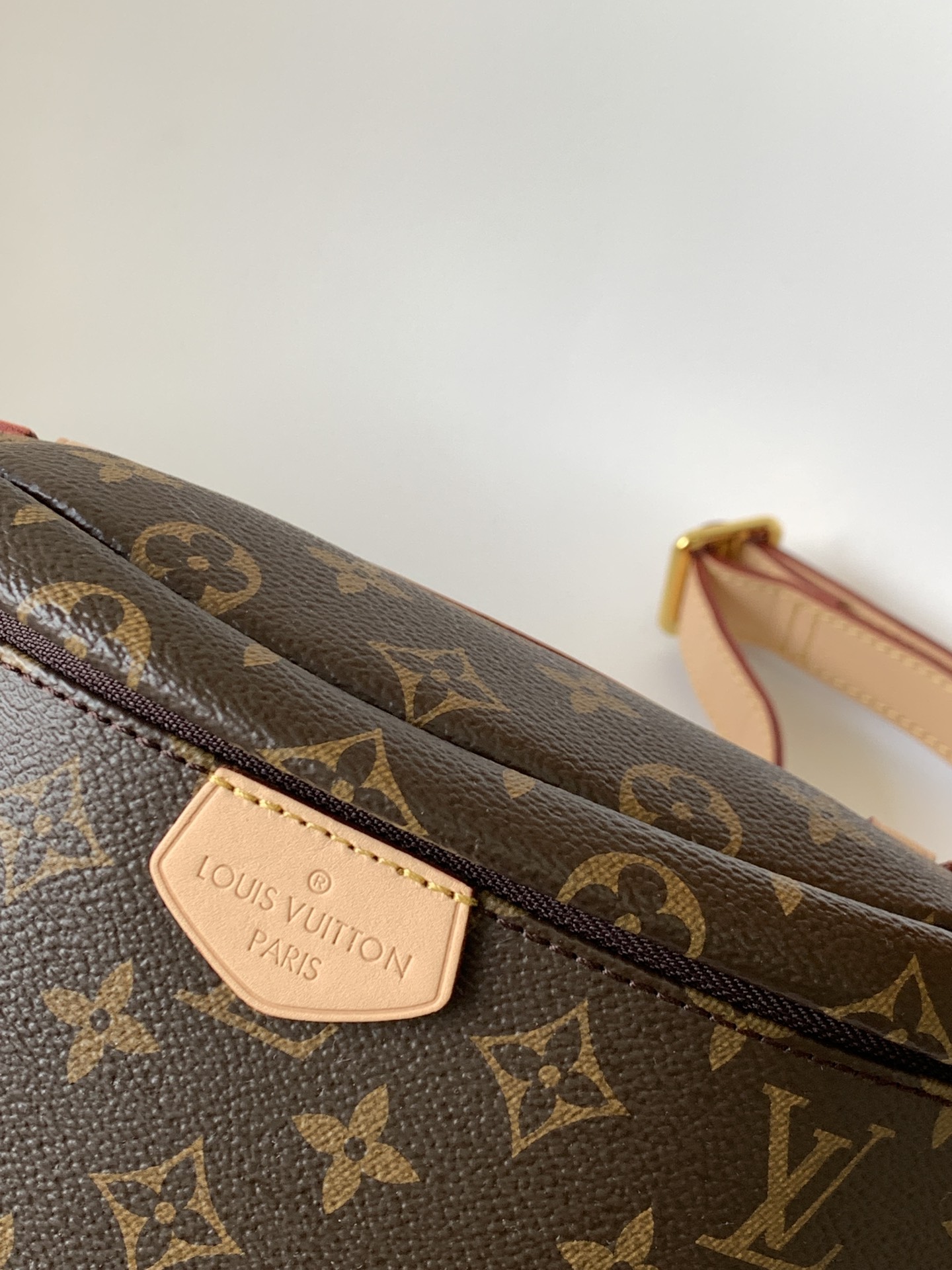 Crafted from classic Monogram canvas and accented with a "Louis Vuitton - Bag 4