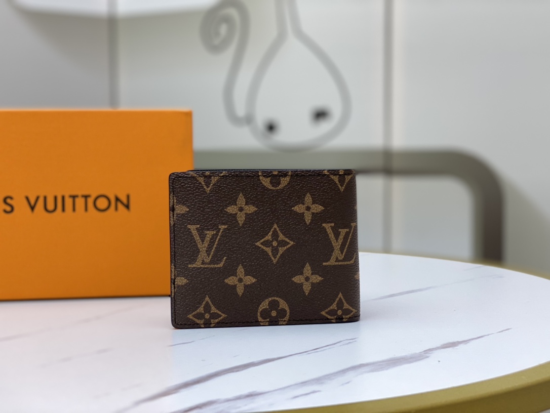 Open view of a bifold leather wallet, showing card slots and cash compartment