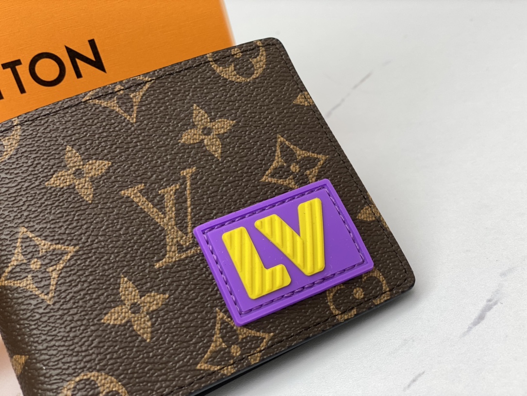 Bifold leather wallet held in hand