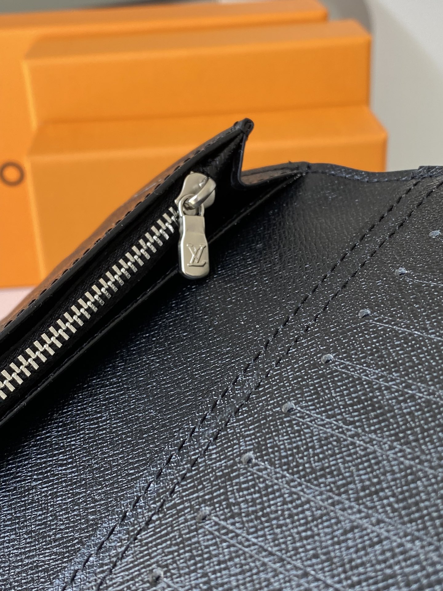 Leather wallet held in hand