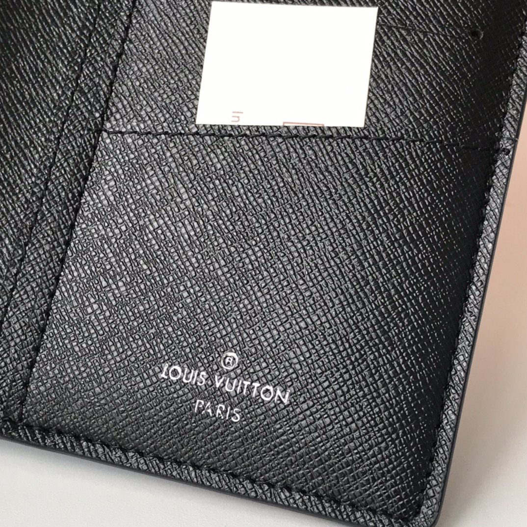 Leather wallet held in hand