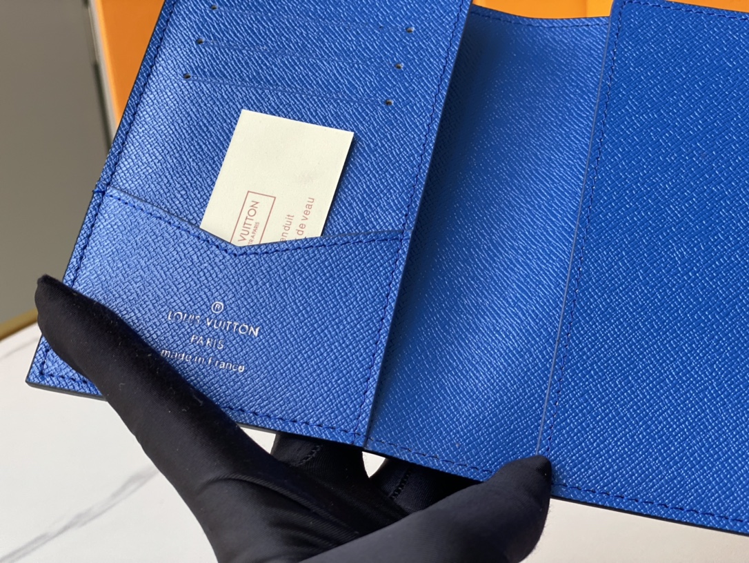 A person using the leather passport holder