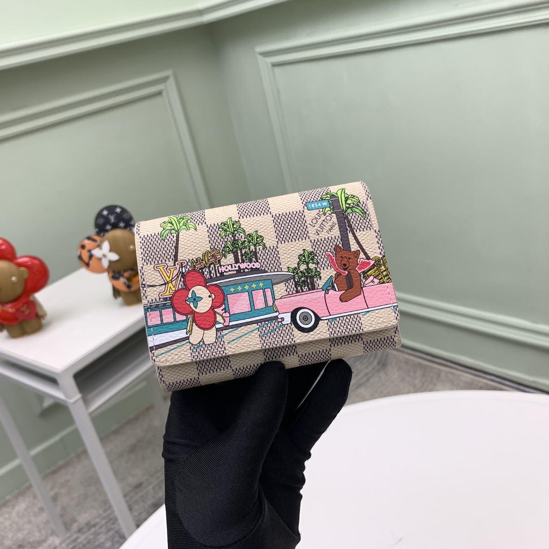 The compact "Victorine Wallet" is crafted from Damier Azur canvas - Bag 2