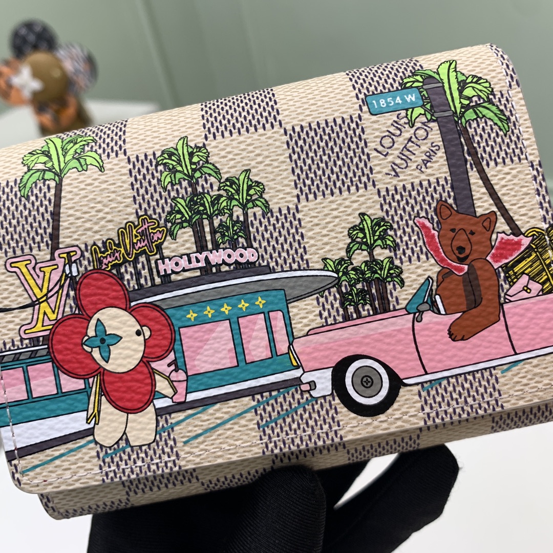 The compact "Victorine Wallet" is crafted from Damier Azur canvas - Bag 4