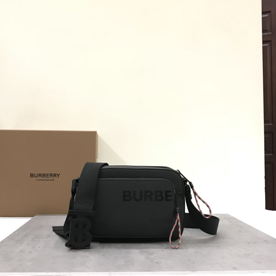 Drawing on the street style of the 1990s, the original B family uses nylon material decorated with Horseferry prints, embellished with luxurious leather trims, and decorated with exclusive logo hooks. A cross-body bag is made of ECONYL® material with elegant leather trims and jacquard worsted brand letter logo. The ECONYL® can be worn cross-body with the adjustable mesh nylon strap. 22 x 11 x 16.5cm adjustable cross-body strap. 1 outer zipper pocket; 1 outer slip pocket. Zipper closure. Shiny metal accessories