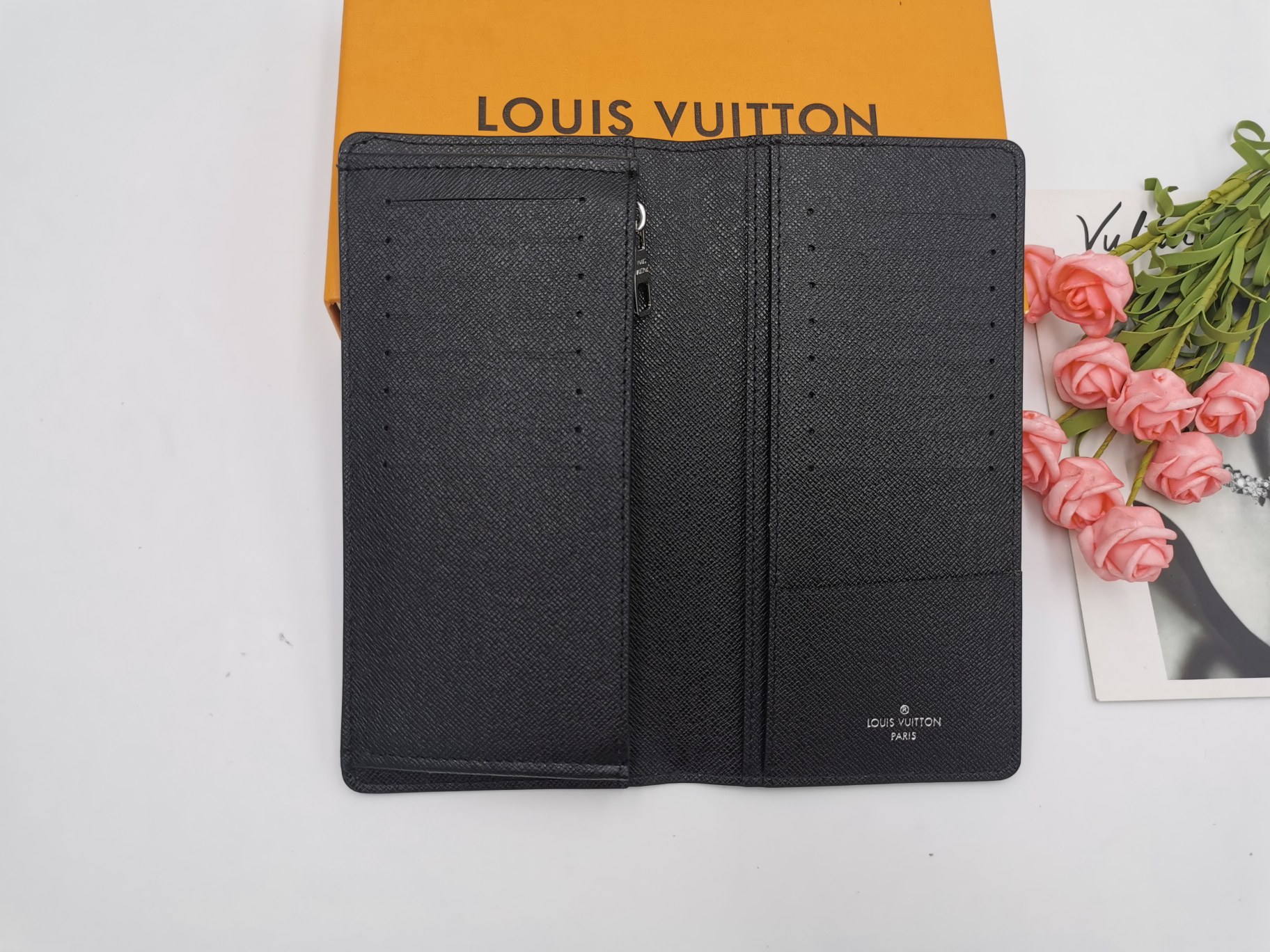 Leather wallet held in hand