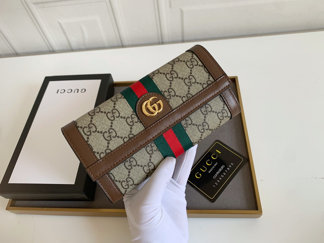 Gucci GGロゴラウンドジップポーチ - クラシックで洗練されたデザイン