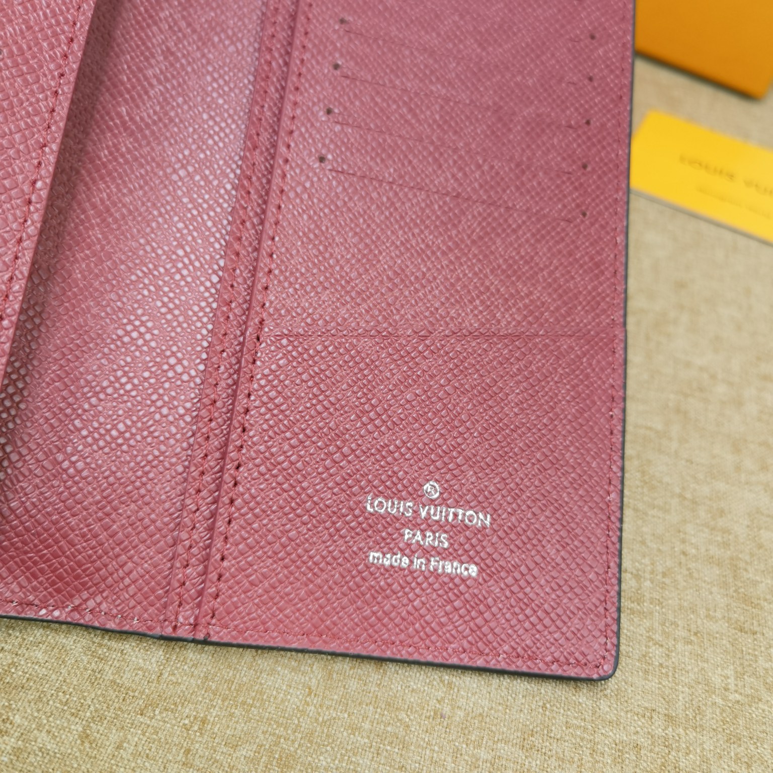 Close up of stitched seams on leather bifold wallet