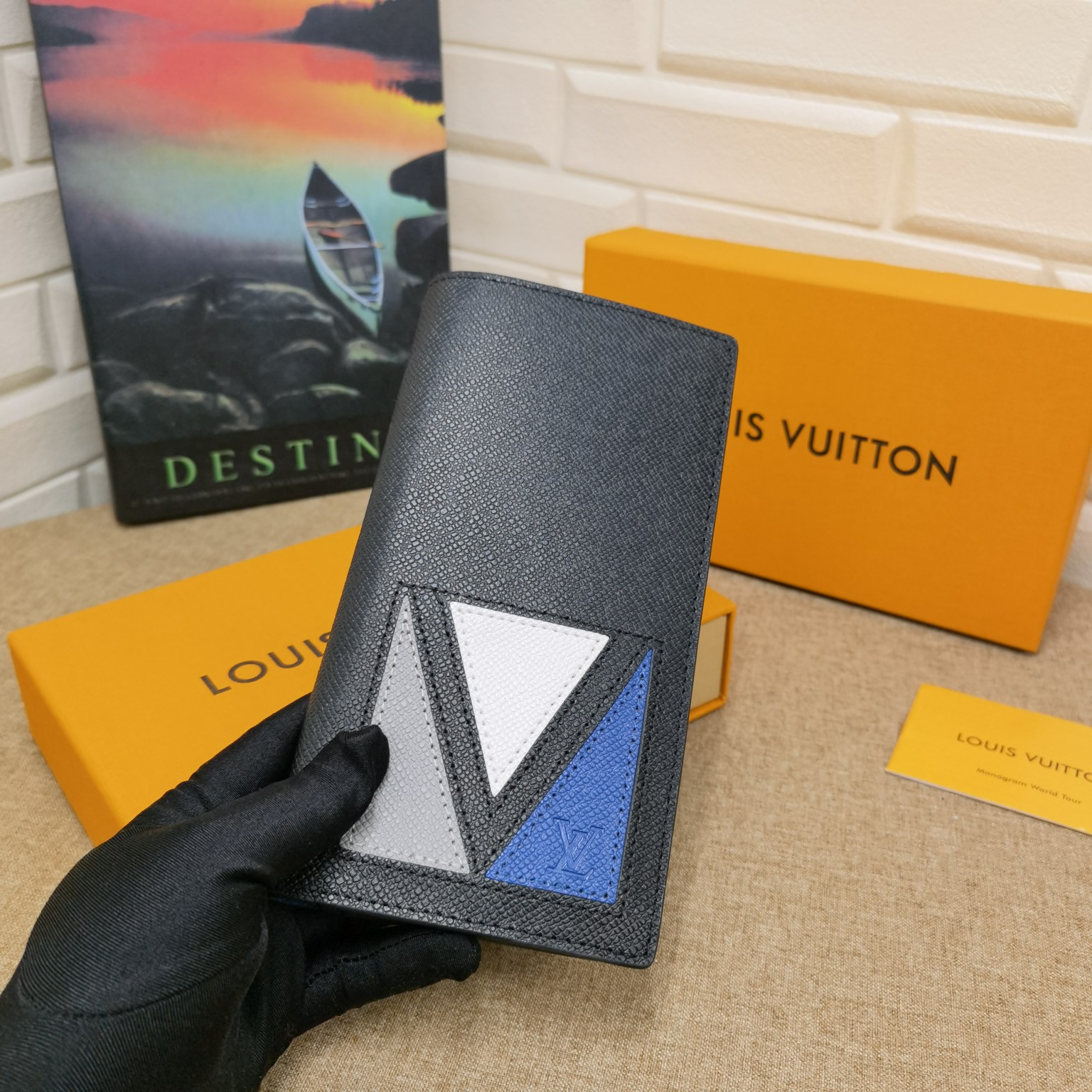 Front view of a minimalist leather bifold wallet
