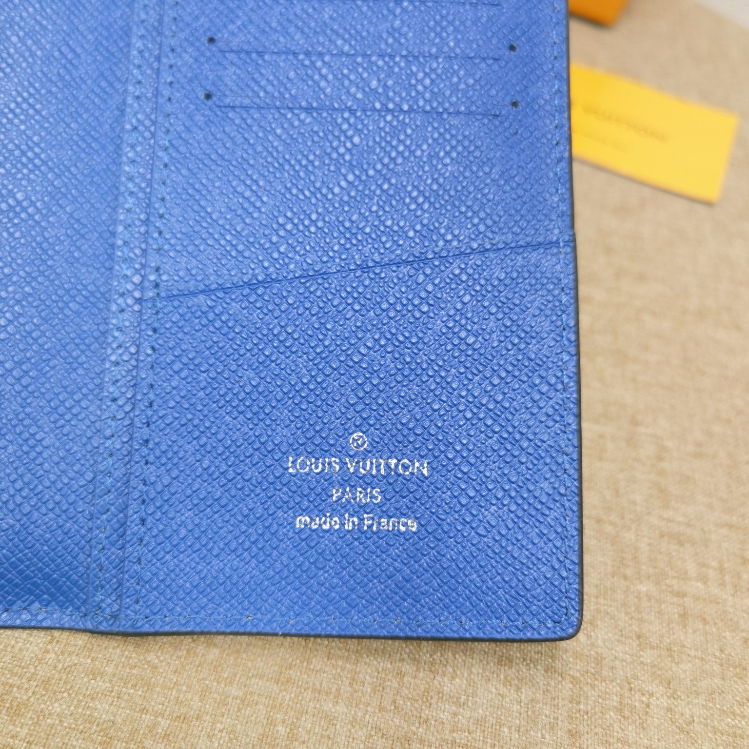 Close up of bill compartment in minimalist leather bifold wallet