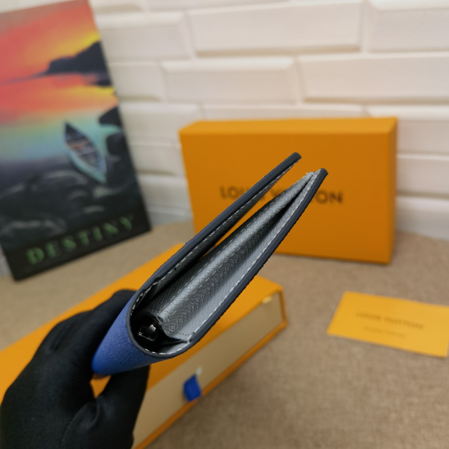 Close up of card slots in textured leather bifold wallet