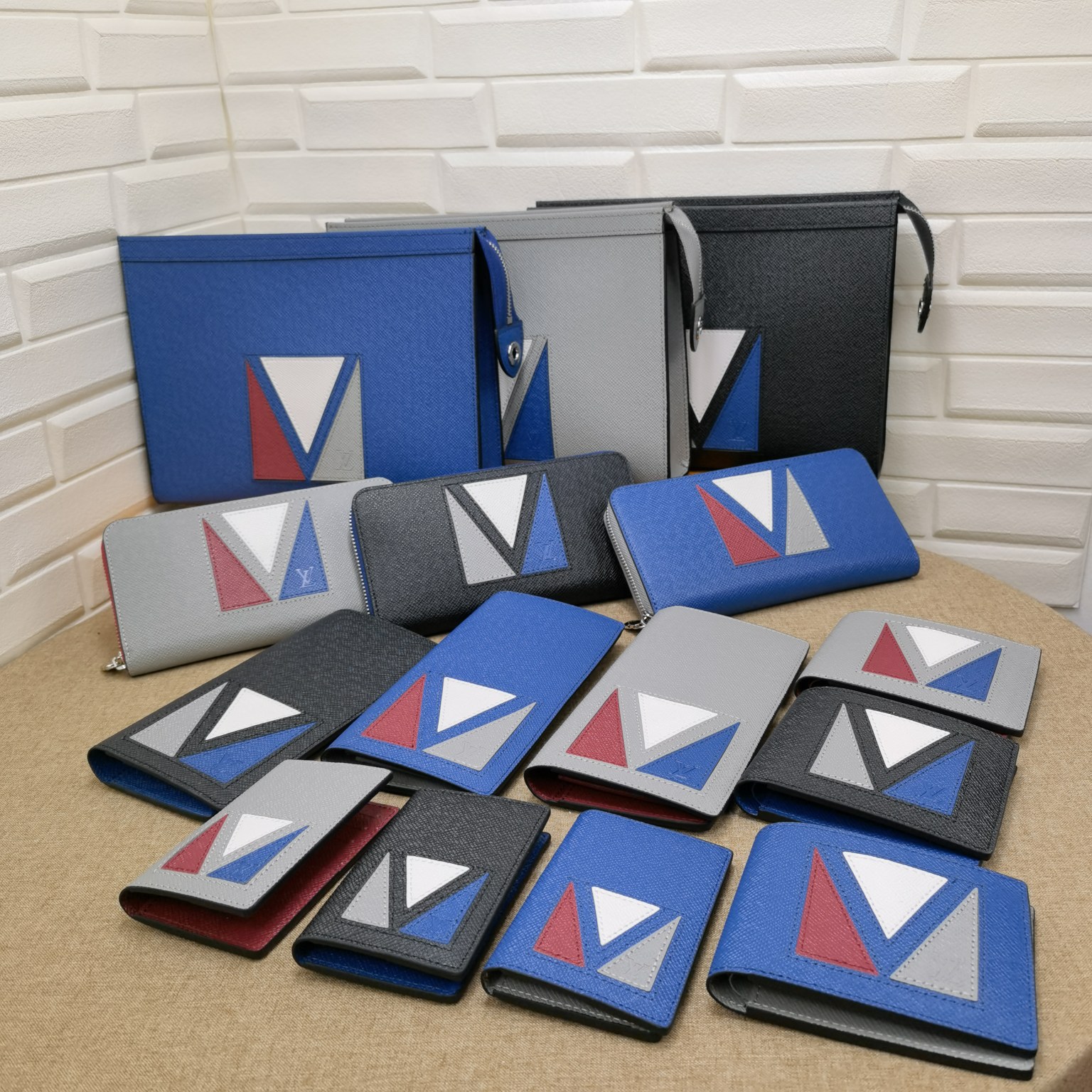 Luxury designer collection featuring wallets and accessories