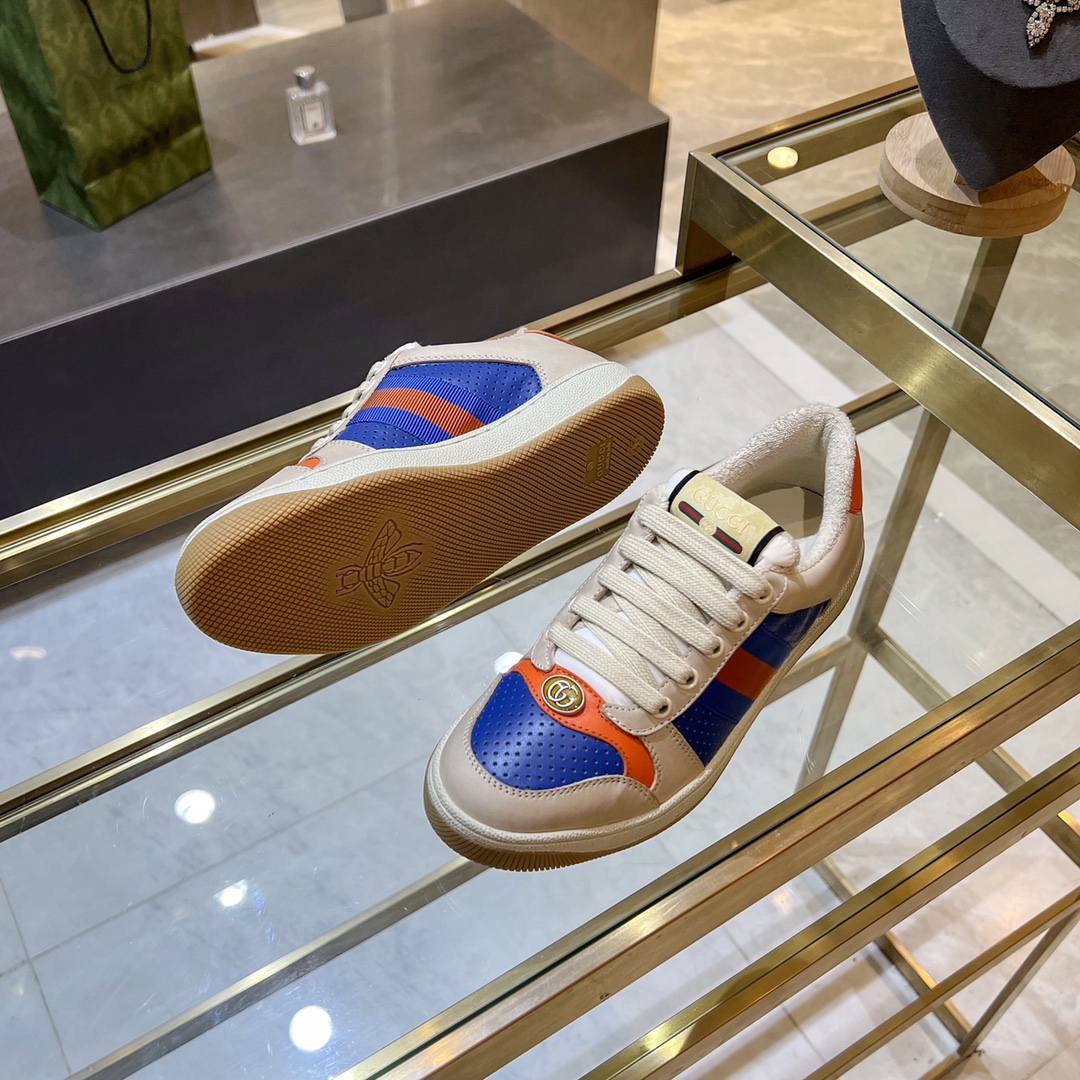 ex fábrica Gucci. zapatitos sucios piel perforada naranja y verde cinchas rojas y azules detalle pie